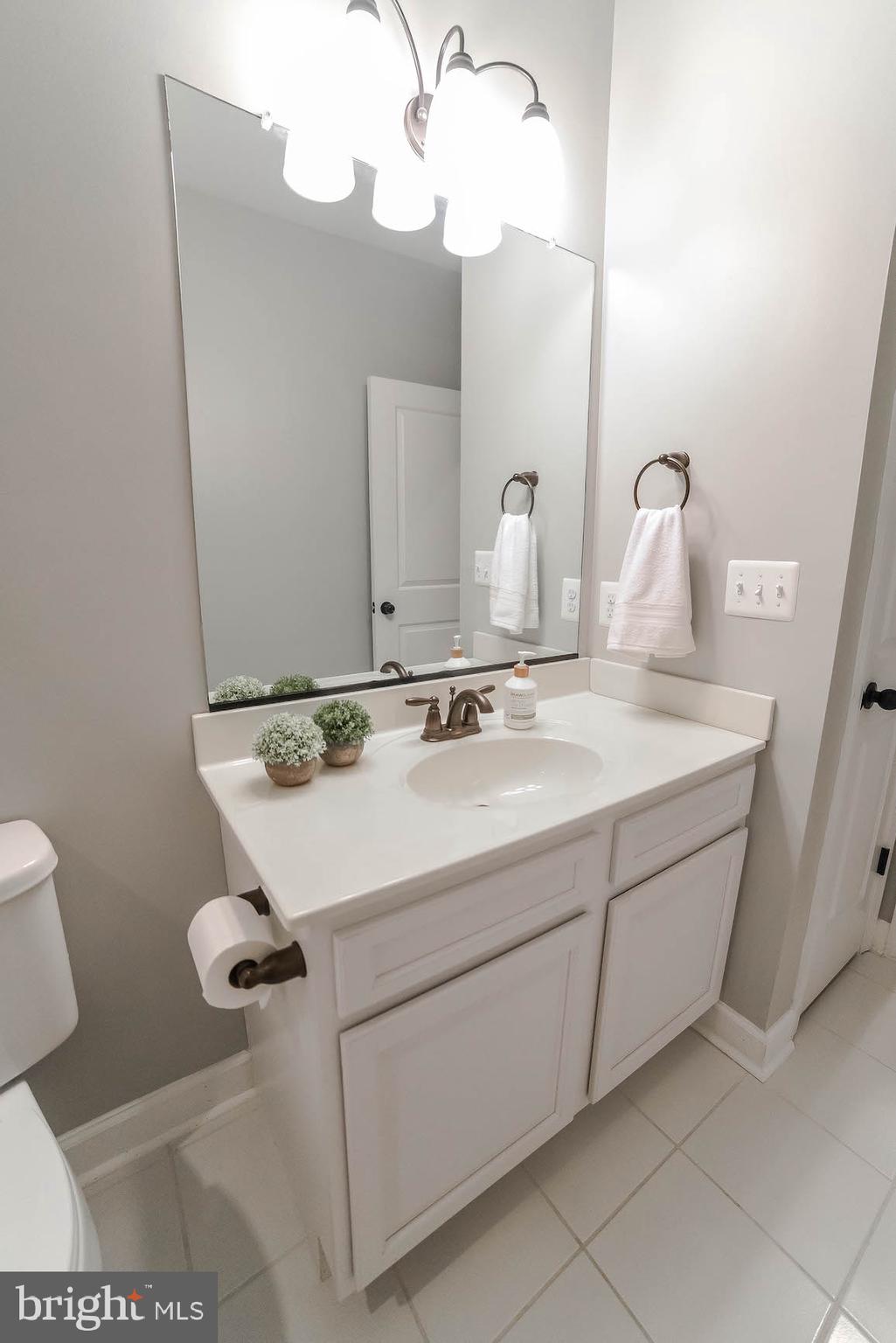 2160 Lowery Road Huntingtown, MD 20639 - Photo 47 of 53 a bathroom with a sink and mirror
