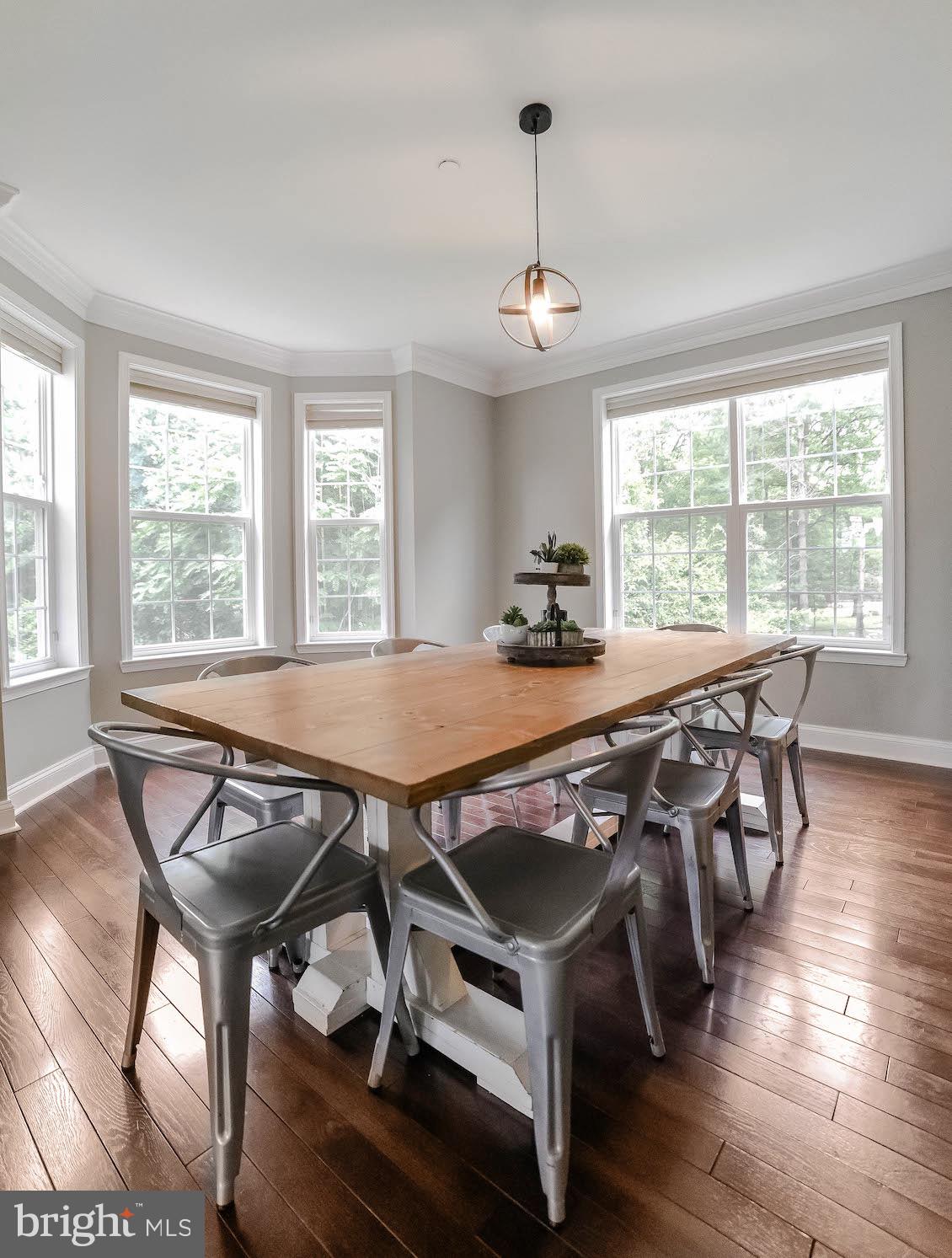 2160 Lowery Road Huntingtown, MD 20639 - Photo 7 of 53 a view of a dining room with furniture wooden floor and chandelier