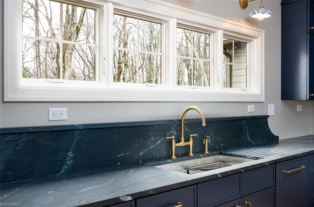 8268 Ballard Road Colfax, NC 27235 - Photo 12 of 50 Wall capped off with an incredible soapstone counters in marine black
