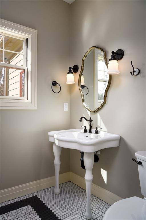 8268 Ballard Road Colfax, NC 27235 - Photo 15 of 50 The old world charm that is evidenced throughout is on full display in the guest bath.