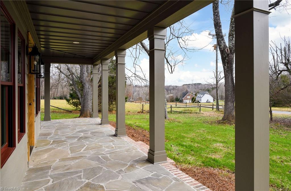 8268 Ballard Road Colfax, NC 27235 - Photo 4 of 50 A porch that beckons you to sit & stay awhile