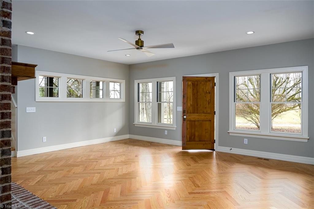 8268 Ballard Road Colfax, NC 27235 - Photo 6 of 50 Even the double hung Pella window placements have maximized the natural light while leaving room to furnish as you like.