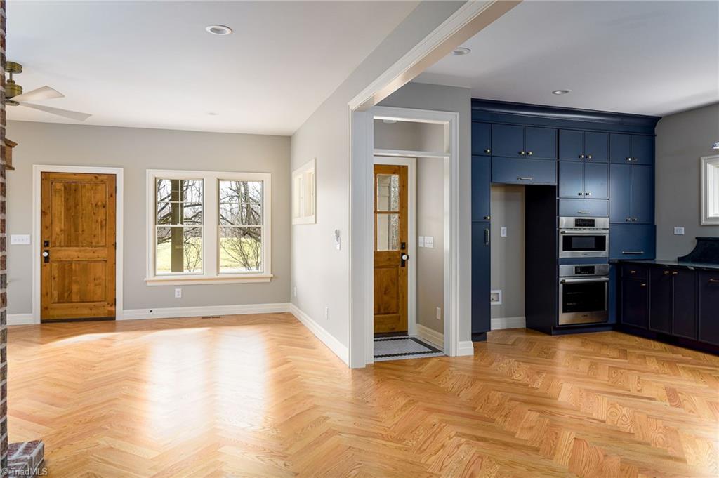 8268 Ballard Road Colfax, NC 27235 - Photo 50 of 50 Looking from the dining area the subtle beauty is showcased in the open floorplan