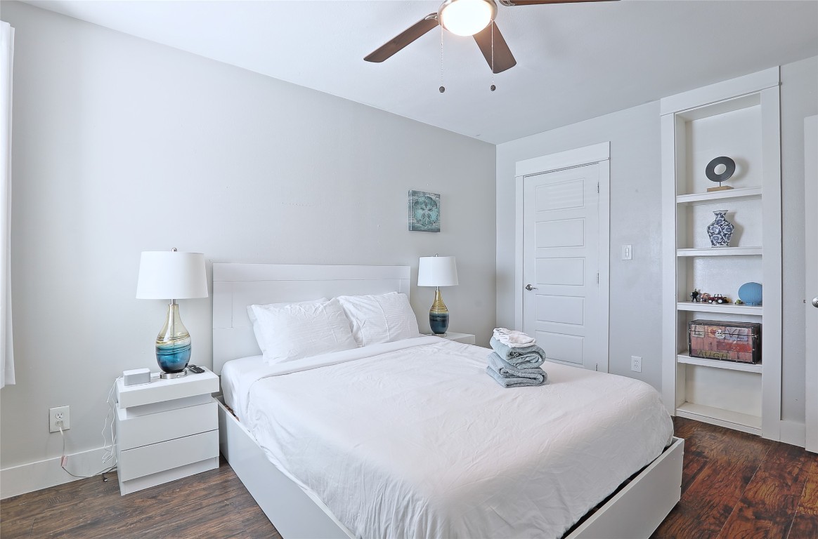 4804 West Wind Trail, Unit 102 Austin, TX 78745 - Photo 18 of 24 a bed room with a bed and a night stand