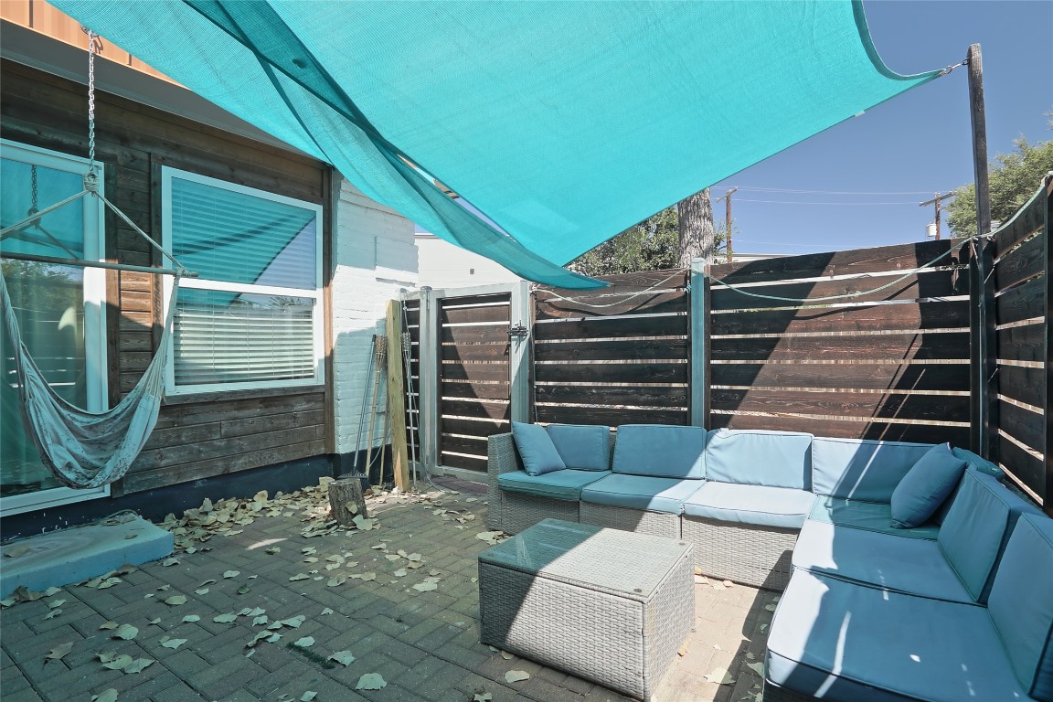 4804 West Wind Trail, Unit 102 Austin, TX 78745 - Photo 24 of 24 a view of a backyard with furniture and a garden