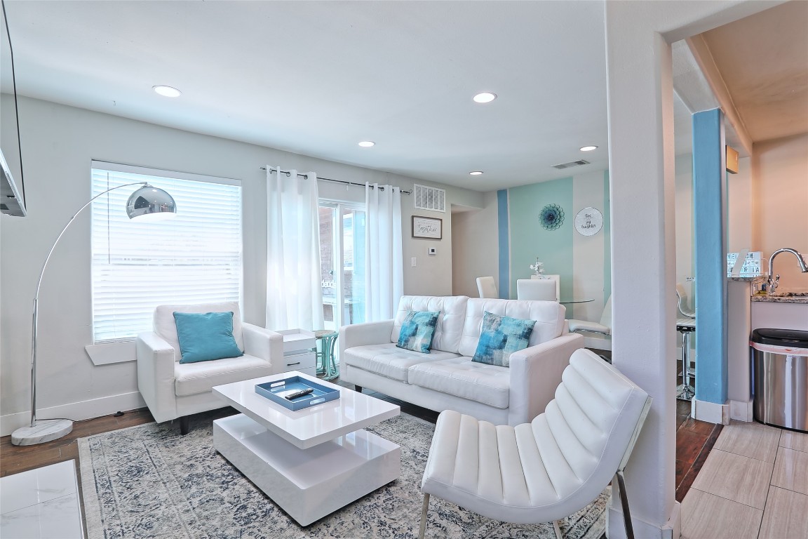 4804 West Wind Trail, Unit 102 Austin, TX 78745 - Photo 3 of 24 a living room with furniture and a couch