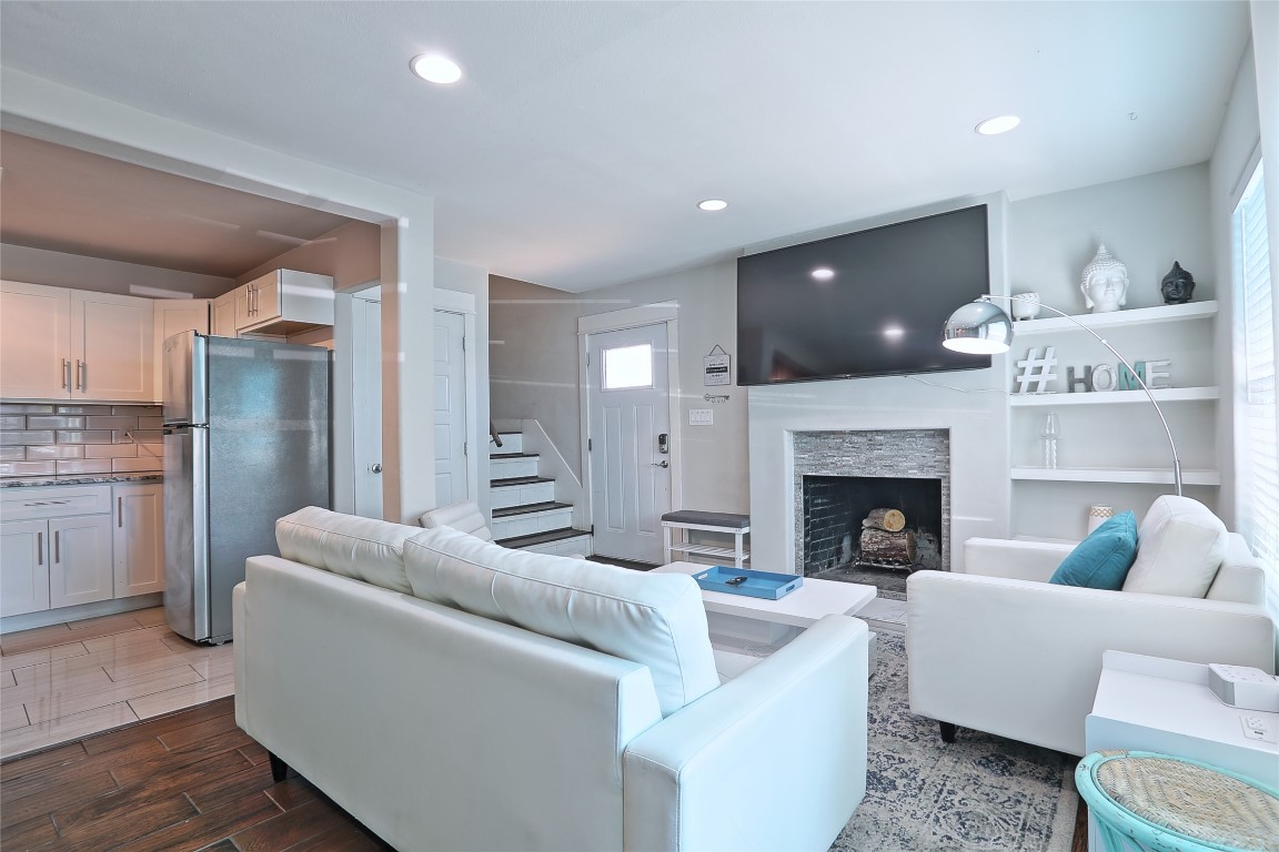 4804 West Wind Trail, Unit 102 Austin, TX 78745 - Photo 5 of 24 a living room with furniture and a fireplace