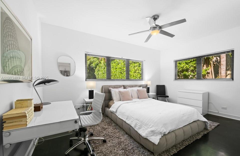 641 Island Road Miami, FL 33137 - Photo 12 of 16 a bedroom with a bed window and a table