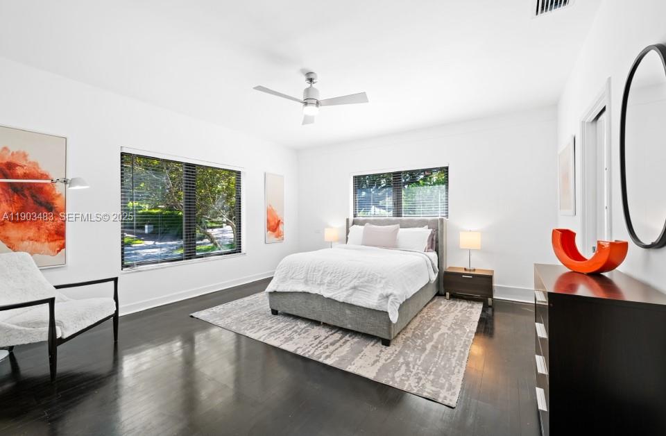 641 Island Road Miami, FL 33137 - Photo 9 of 16 a spacious bedroom with a bed and a window