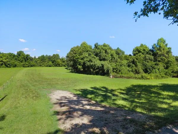 a view of a lake with a yard