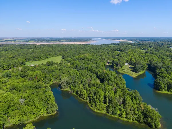 an aerial view of a houses with a yard