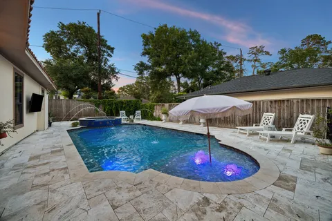 a view of a house with a swimming pool