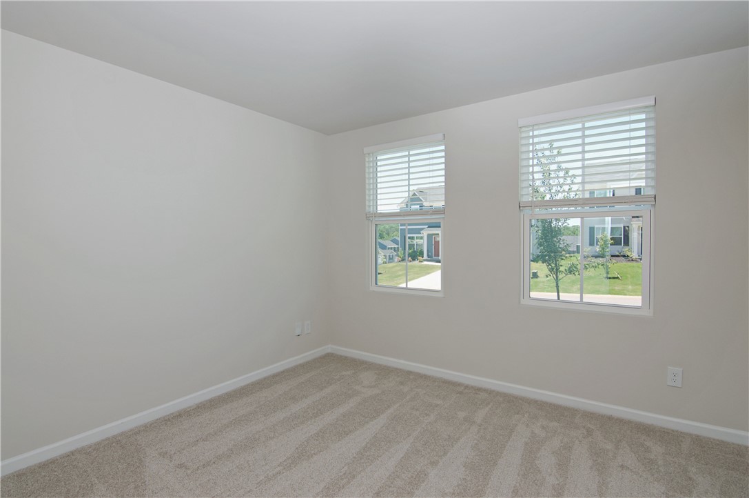 723 Peridot Way Westminster, SC 29693 - Photo 26 of 45 A light-filled room features plush carpeting and multiple windows.