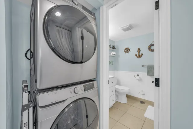 a bathroom with a toilet and a mirror