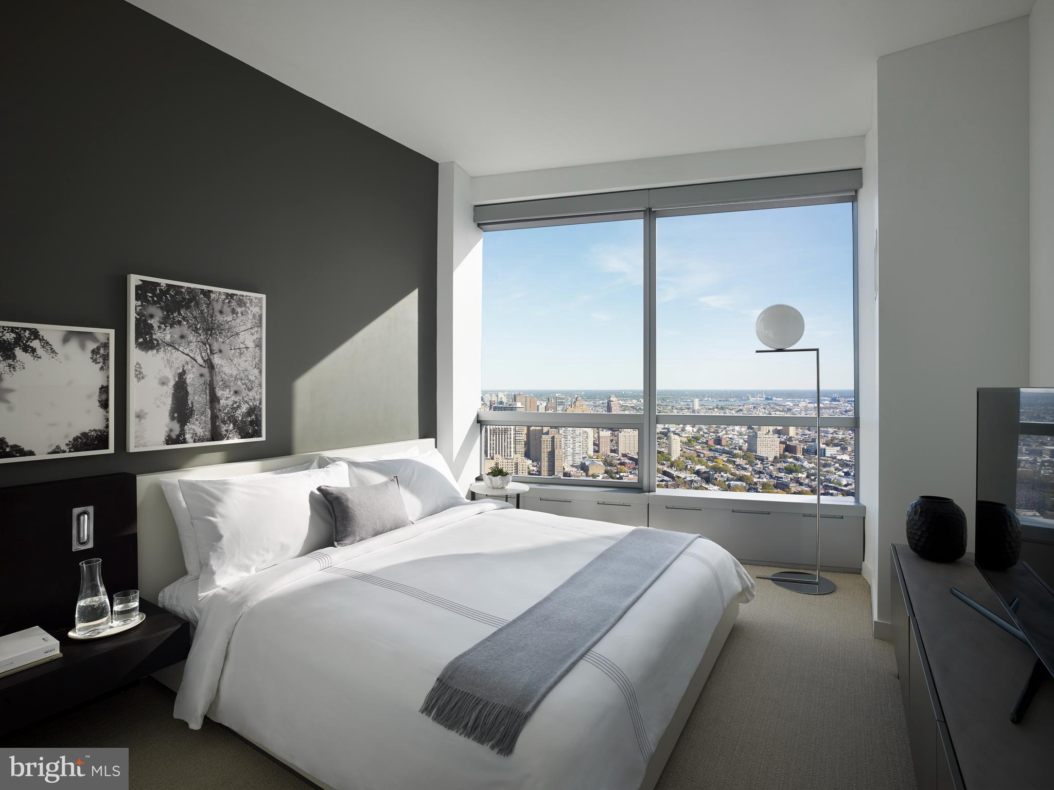 2930 Walnut Street, Unit 3614 Philadelphia, PA 19104 - Photo 33 of 33 a bedroom with a large bed and a large window