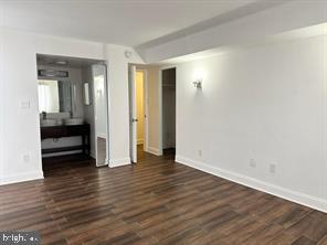 1836 Metzerott Road, Unit 901 Hyattsville, MD 20783 - Photo 11 of 20 a view of a room with wooden floor and a bathroom