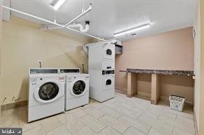 1836 Metzerott Road, Unit 901 Hyattsville, MD 20783 - Photo 16 of 20 a utility room with dryer and washer