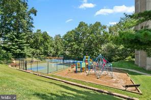 1836 Metzerott Road, Unit 901 Hyattsville, MD 20783 - Photo 18 of 20 a view of a swimming pool with a patio