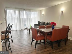 1836 Metzerott Road, Unit 901 Hyattsville, MD 20783 - Photo 6 of 20 a dining room with furniture and wooden floor