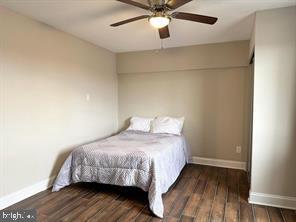1836 Metzerott Road, Unit 901 Hyattsville, MD 20783 - Photo 10 of 20 a bedroom with a bed and wooden floor