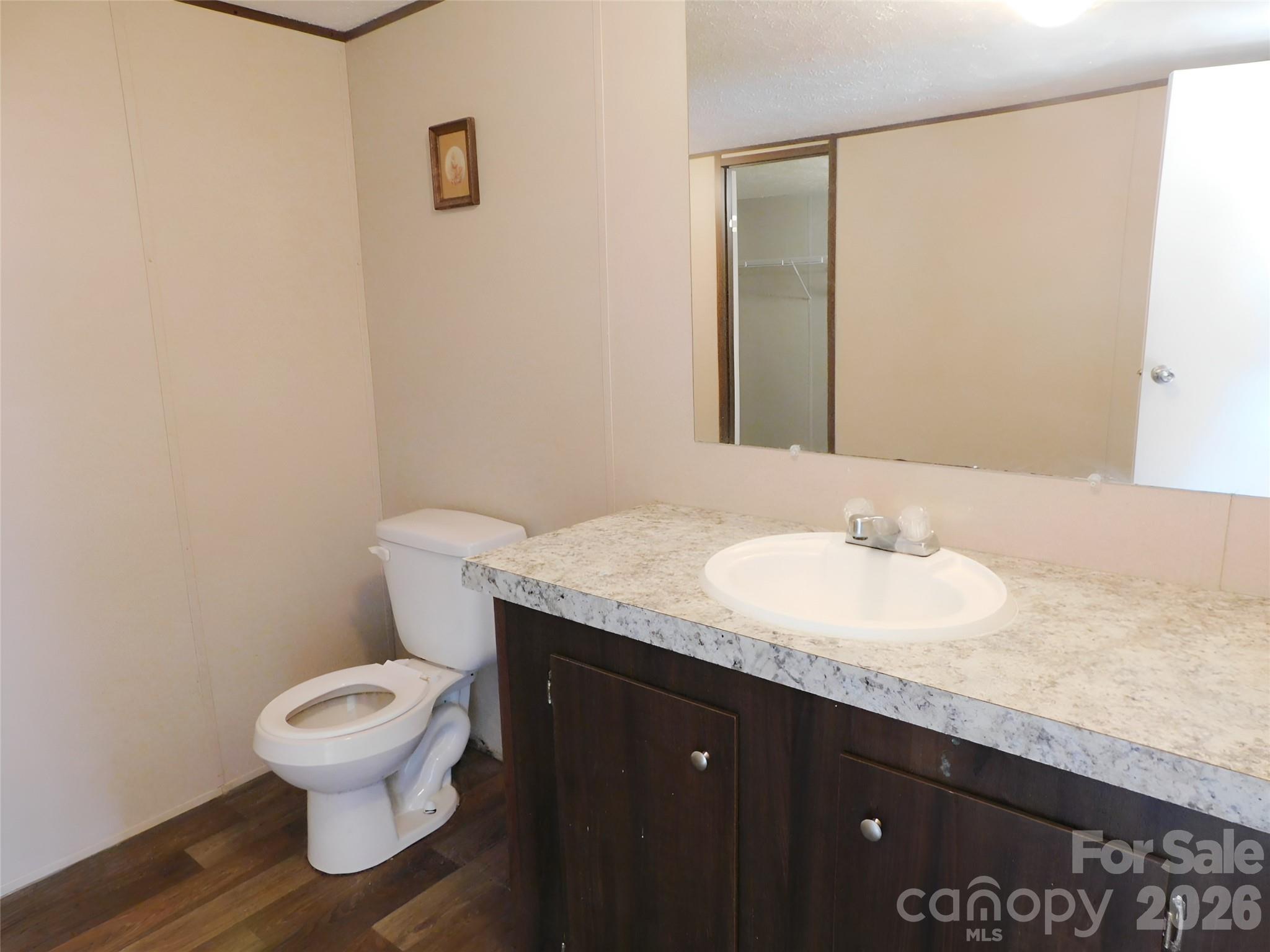 149 Bramble Trail Salisbury, NC 28144 - Photo 20 of 27 a bathroom with a granite countertop toilet sink and mirror