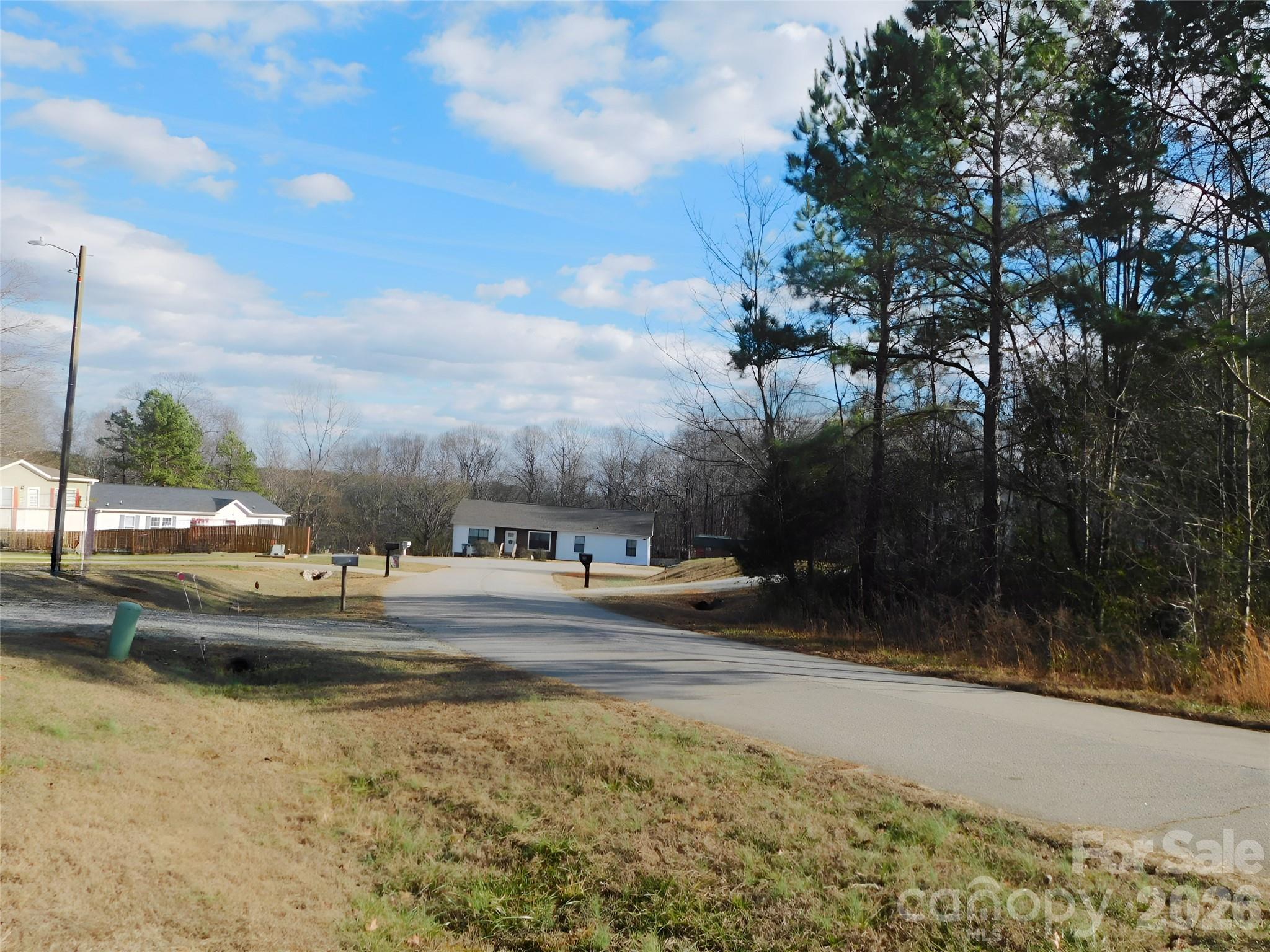 149 Bramble Trail Salisbury, NC 28144 - Photo 26 of 27 a view of car parked on the side of road with city view