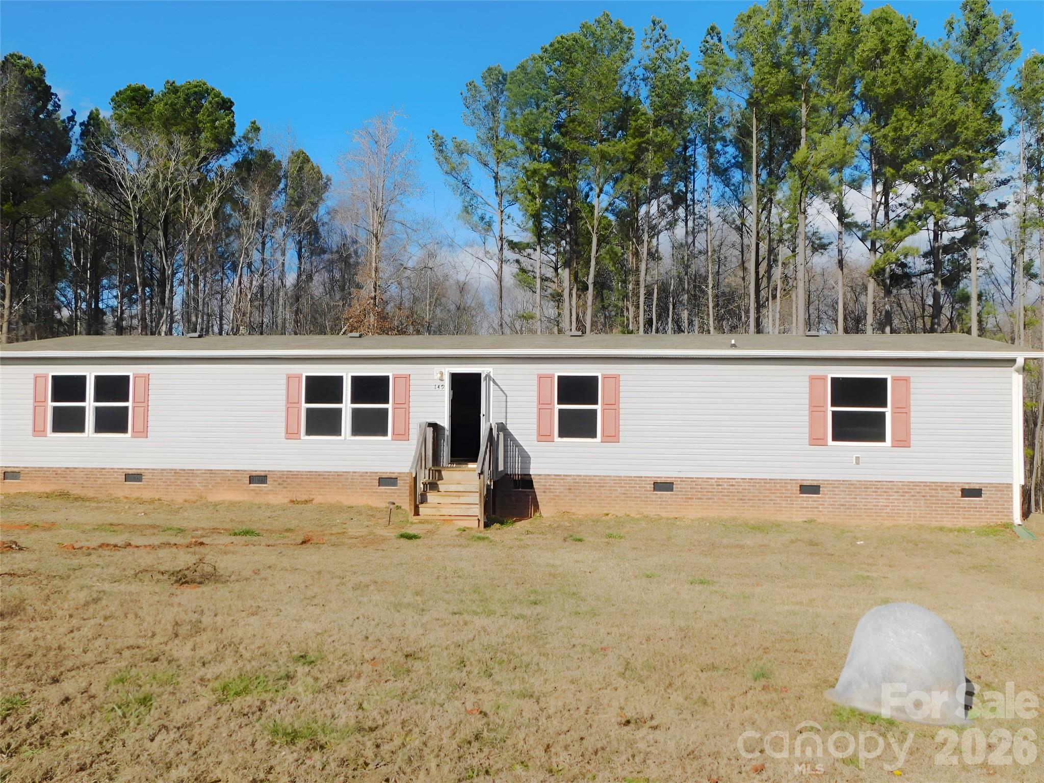 149 Bramble Trail Salisbury, NC 28144 - Photo 5 of 27 a view of a backyard with palm trees