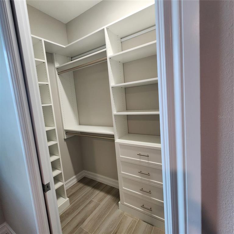 512 Blue Shell Loop Sarasota, FL 34240 - Photo 29 of 44 a view of walk in closet with empty racks