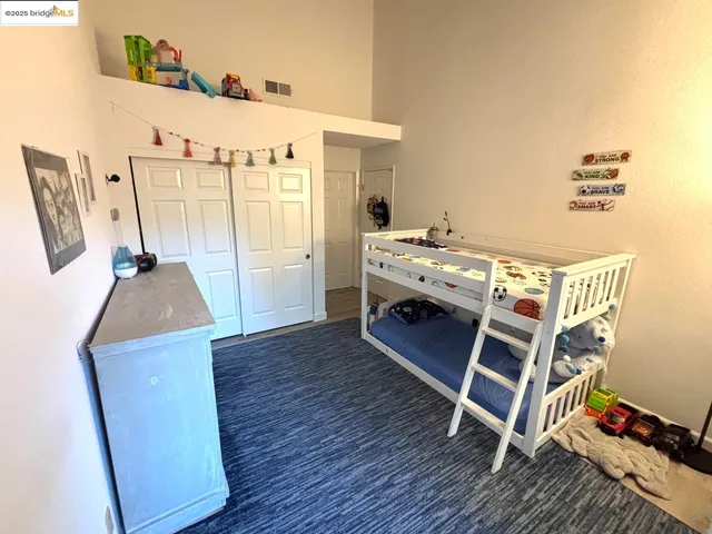 a utility room with wooden floor and furniture