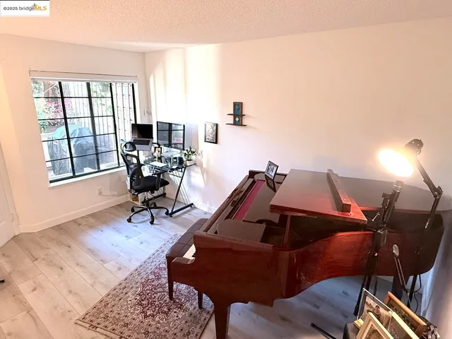 a view of a workspace with furniture