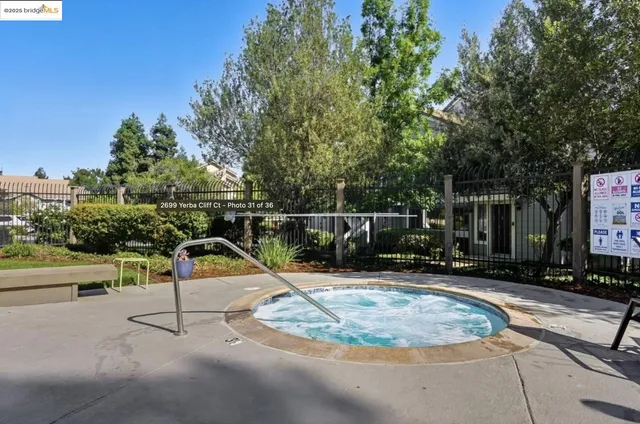 a view of a swimming pool with outdoor seating