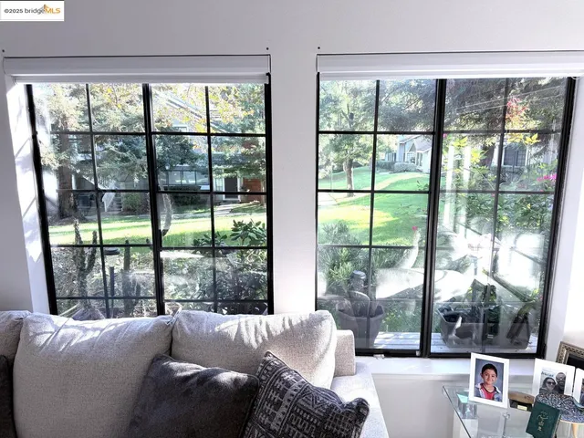a living room with couch and a large window
