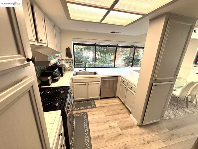 a utility room with a sink a washer and dryer