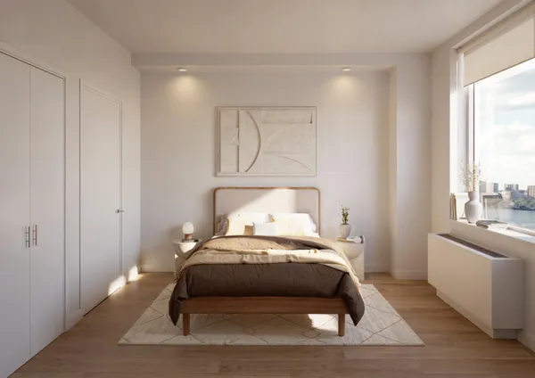 a bedroom with a bed and window