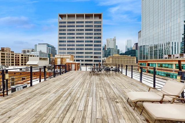 417 South Jefferson Street, Unit 209B Chicago, IL 60607 - Photo 17 of 21 a view of a balcony with chairs