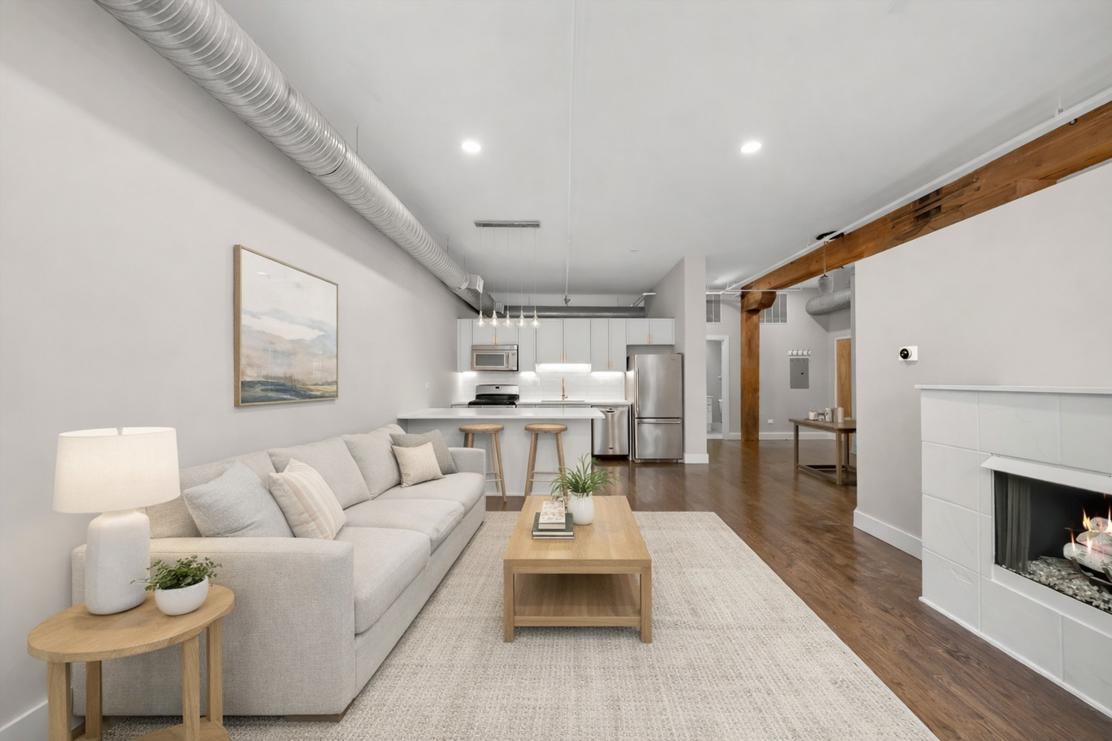 417 South Jefferson Street, Unit 209B Chicago, IL 60607 - Photo 7 of 21 a living room with furniture and a fireplace