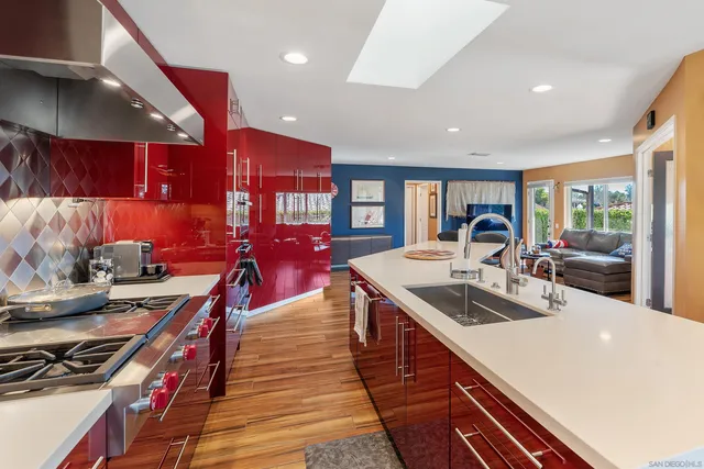 a kitchen with stainless steel appliances granite countertop a lot of counter space and a sink