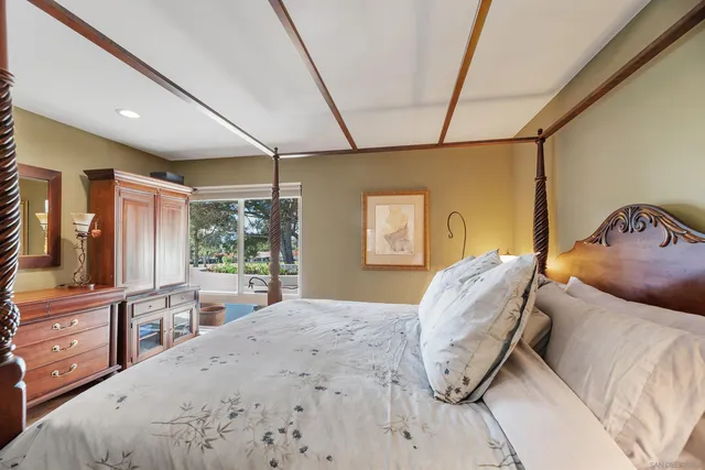 a bed room with a bed and a chair