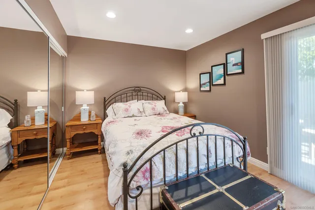 a bed sitting in a bedroom next to a window