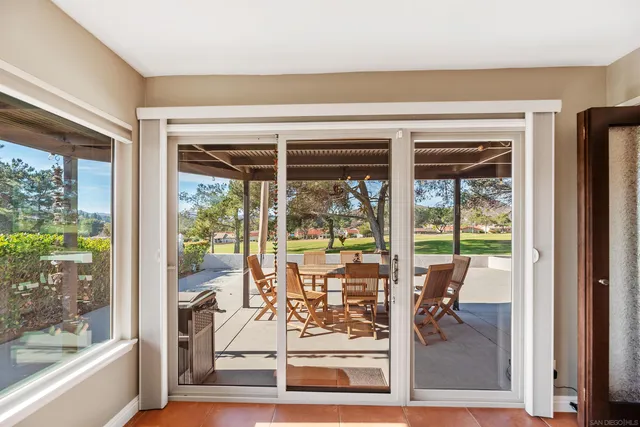 a view of a living room and balcony