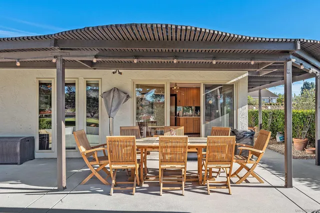 a dining area with furniture and outdoor view