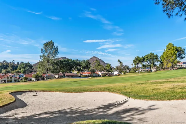 a view of a golf course with a lake