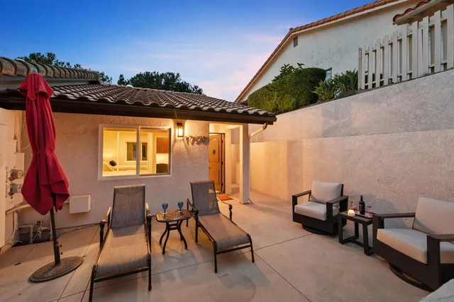 a view of balcony with furniture