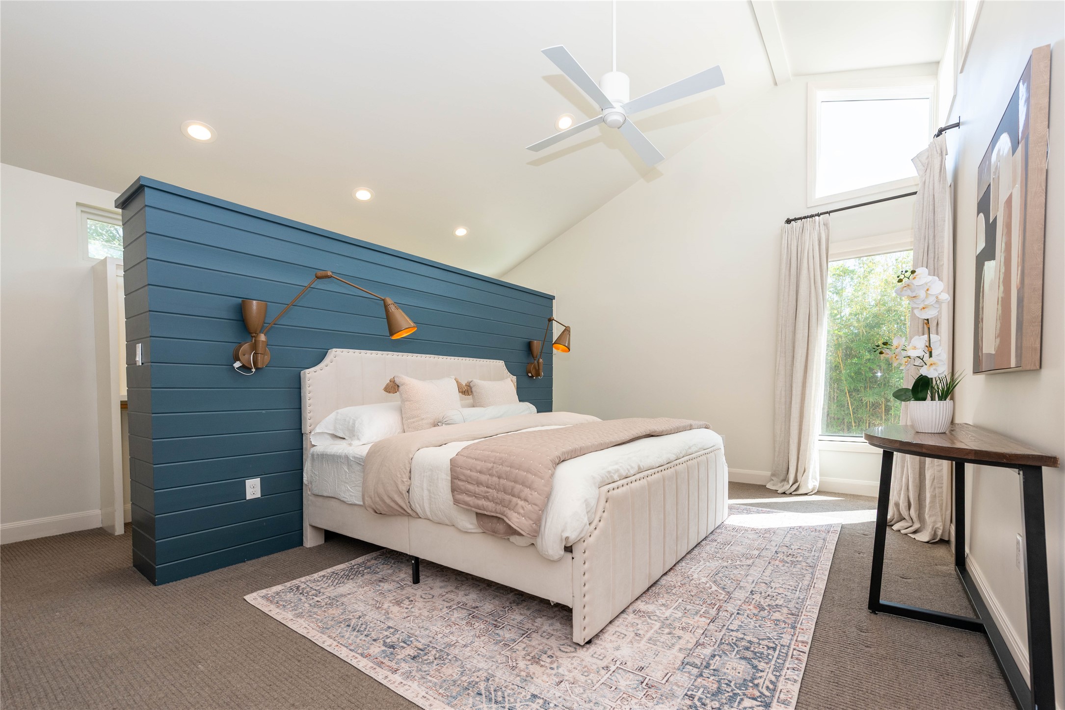 503 East 46th Street Austin, TX 78751 - Photo 13 of 25 Vaulted ceilings with exposed beams, a built-in shiplap accent wall, and recessed lighting