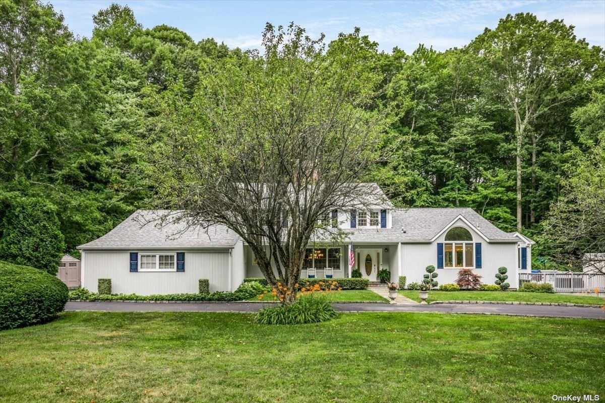 1512 Laurel Hollow Road Syosset, NY 11791 - Photo 1 of 1 a front of a house with a garden and trees