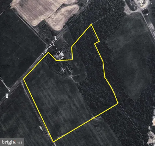 a view of a big yard with an outdoor space and seating