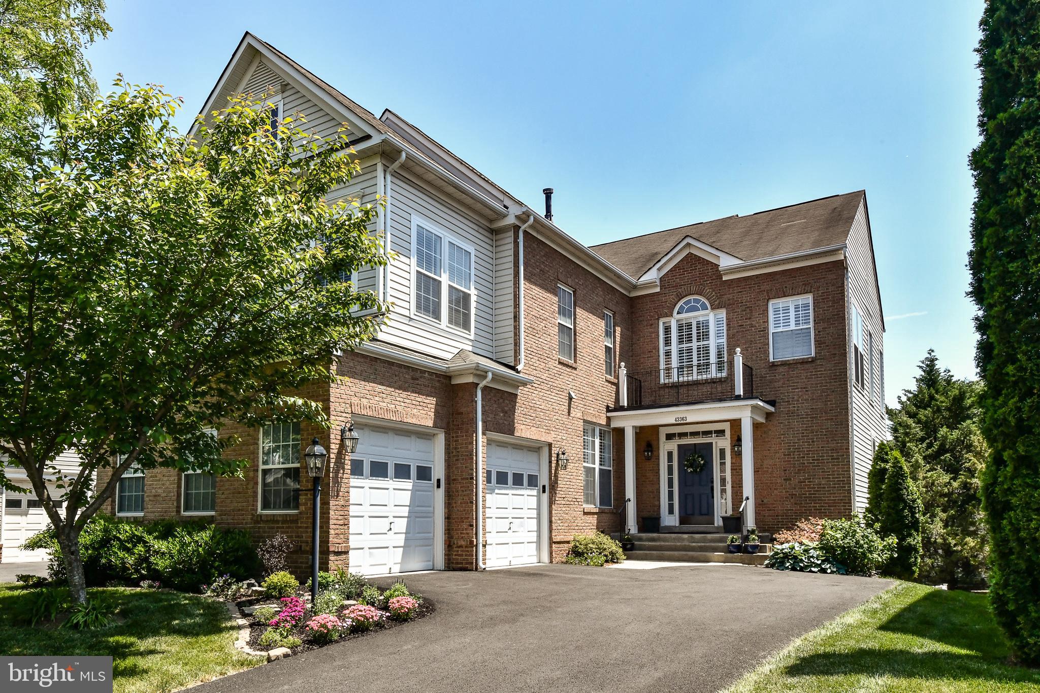 43363 Fullerton Street Ashburn, VA 20147 - Photo 1 of 44 a front view of a house with yard
