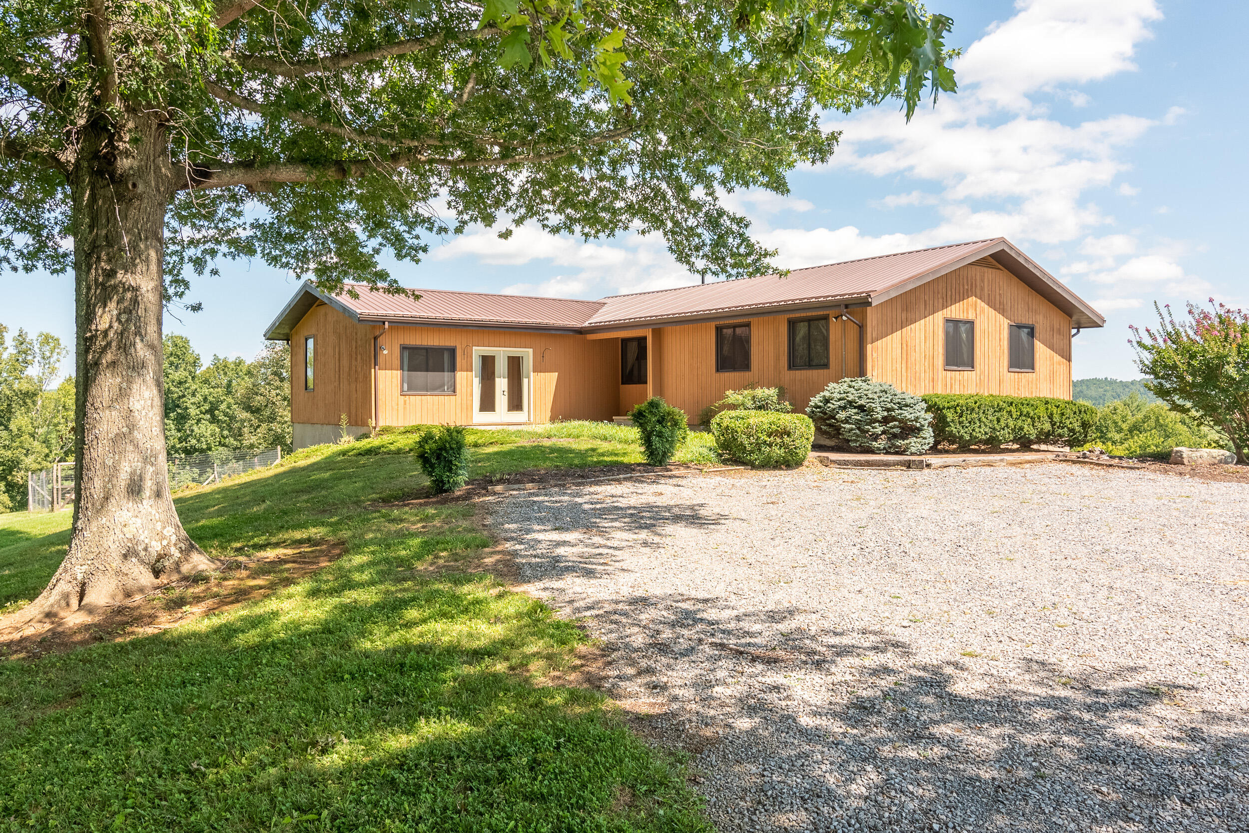 995 White Oak Grove Road Northeast Riner, VA 24149 - Photo 1 of 70 a front view of a house with a yard