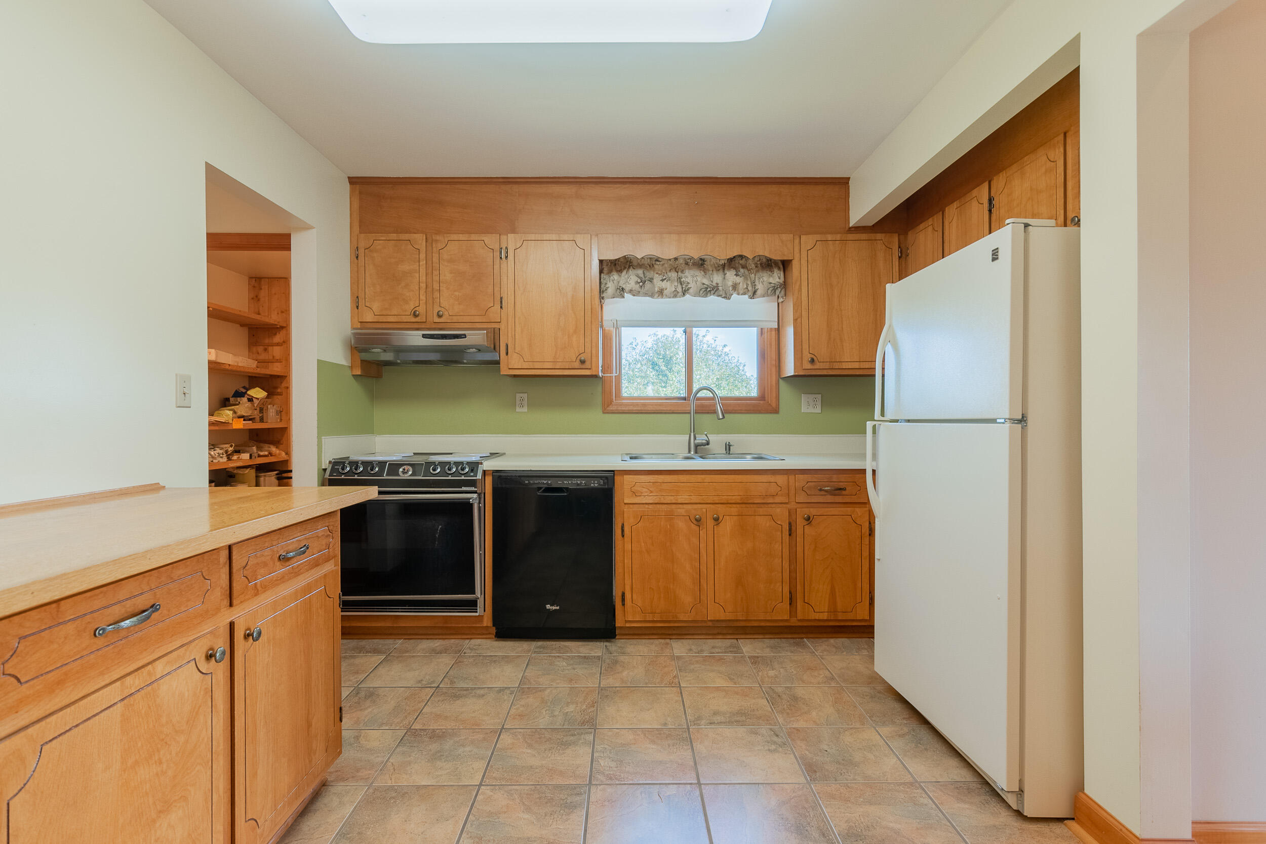 995 White Oak Grove Road Northeast Riner, VA 24149 - Photo 12 of 70 a kitchen with stainless steel appliances granite countertop a refrigerator and a stove