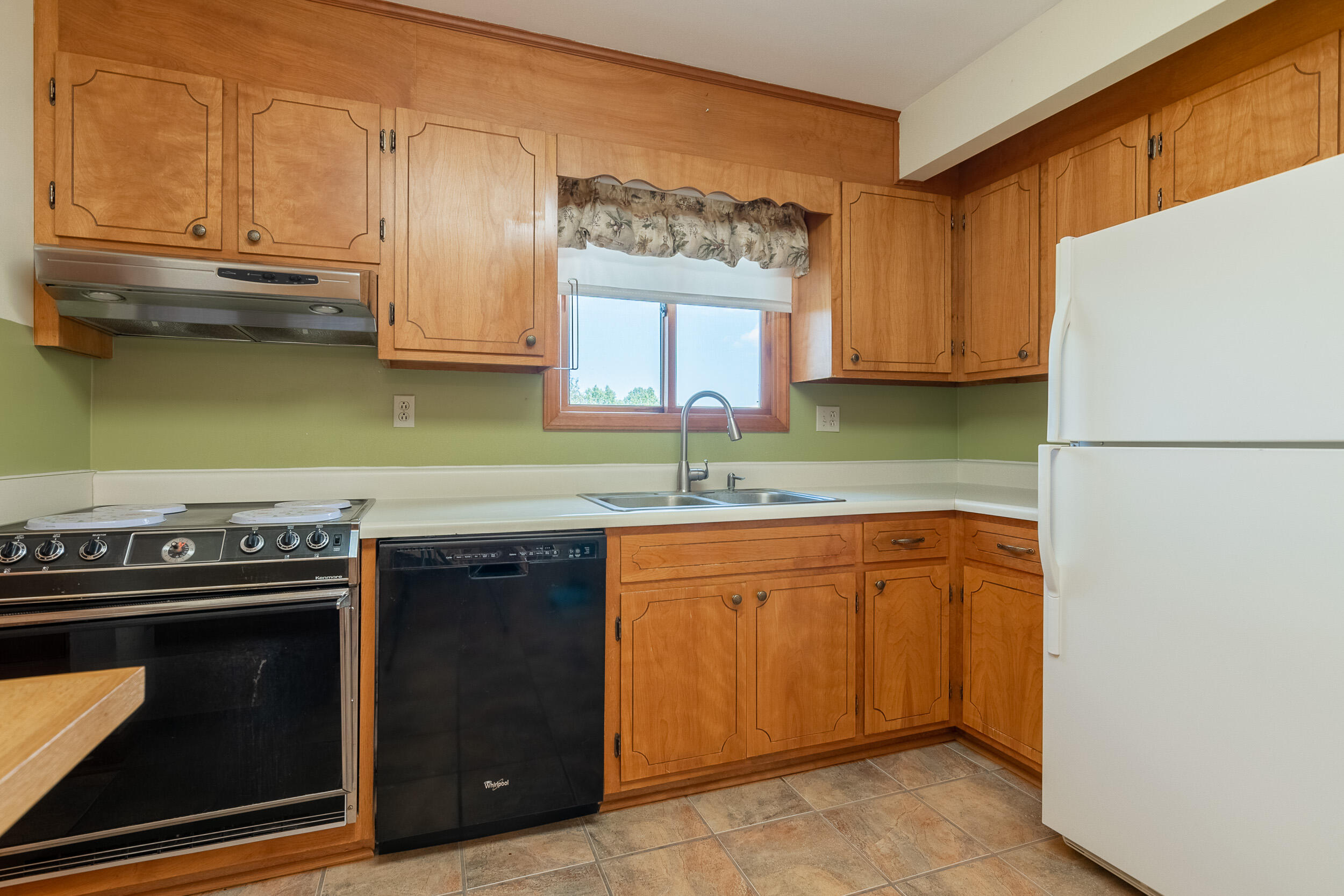 995 White Oak Grove Road Northeast Riner, VA 24149 - Photo 13 of 70 a kitchen with stainless steel appliances granite countertop a stove a sink and a refrigerator